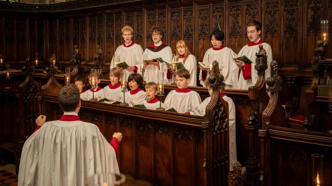 Chapel Choir singing in the Stalls