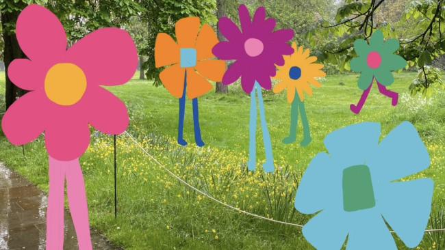 Drawn flowers superimposed on a photo of College grounds