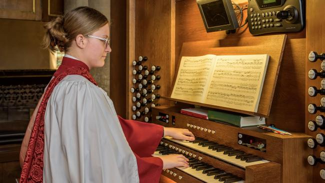 Image of Organ Scholar practicing on the Hudleston Organ