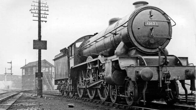 A steam train on railway tracks